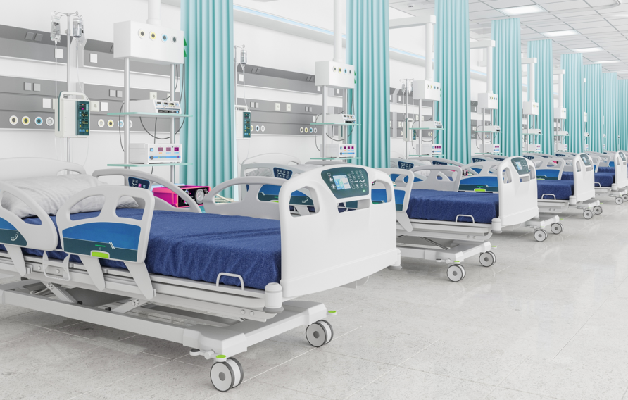 Stock image of blue hospital beds lined up